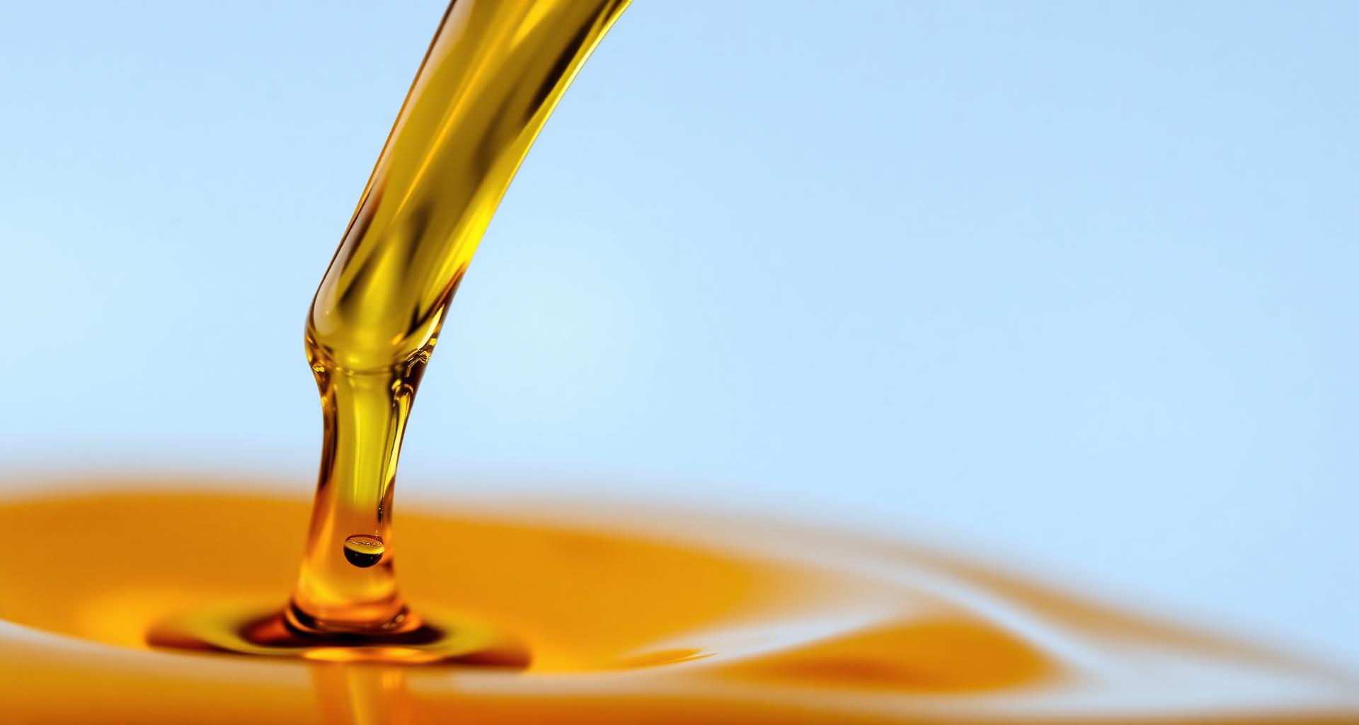 Golden industrial lubricant flowing